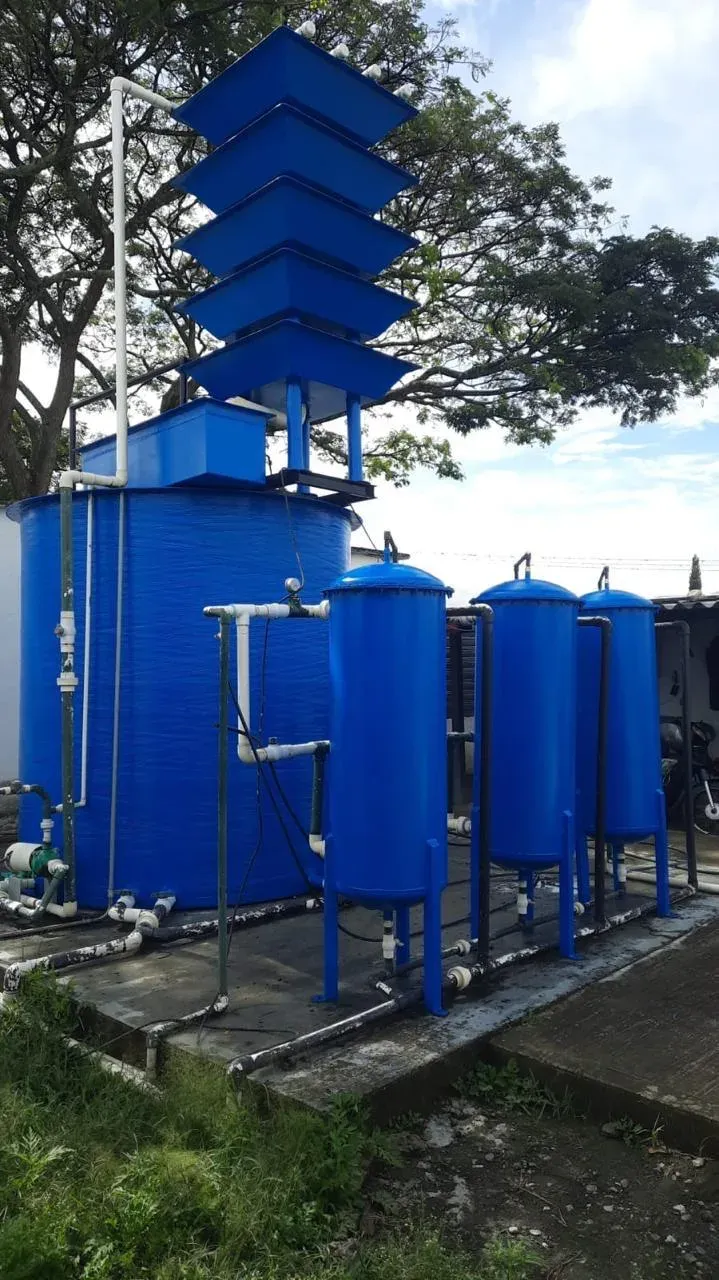 Water treatment plant with an aeration tower, tanks and filters